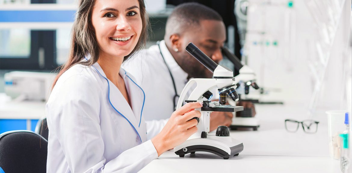 smiling doctor microscope